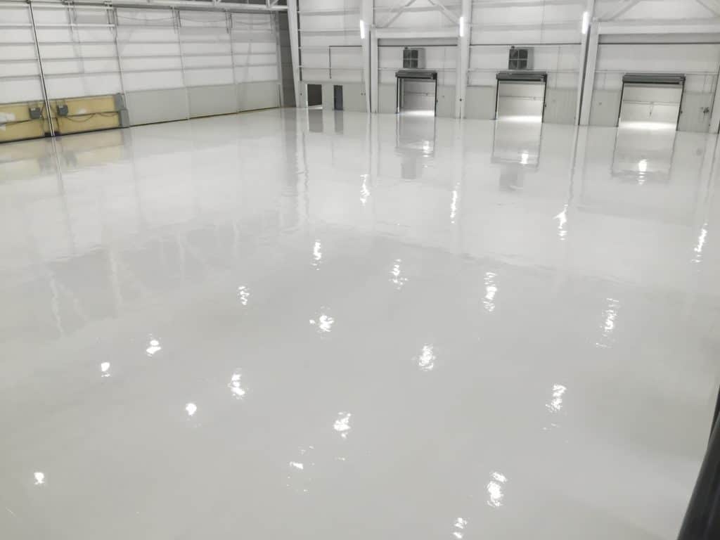 Reflactive white epoxy coated on a big commercial garage floor