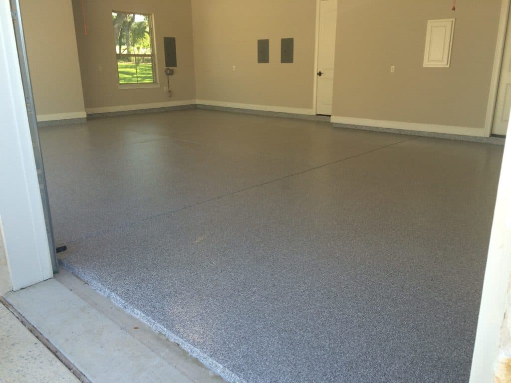 Chip epoxy coated on a square concrete floor of a residential house