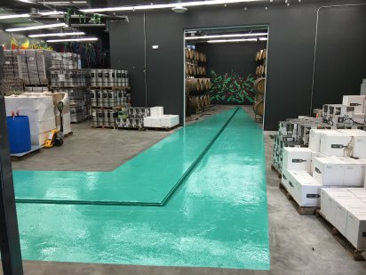 Beautiful green epoxy coated floor of a industrial storage space