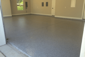 Chip epoxy coated on a square concrete floor of a residential house