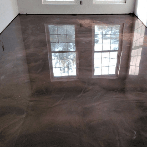 Reflactive metalic epoxy coating installed on a square concrete floor of a residential house