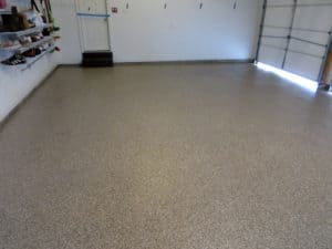 Chip epoxy coated on a concrete square floor of a commercial garage