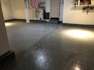 Black chip epoxy flooring design of a garage