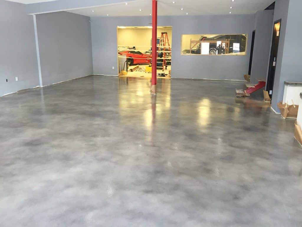 Solid stained epoxy installed for concrete showroom garage floor