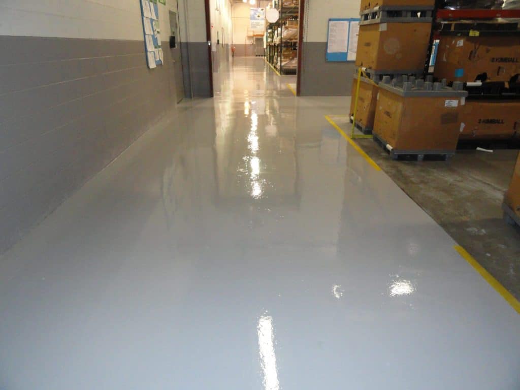 Gray solid epoxy coated in a industrial storage facility floor