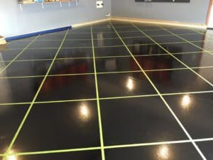 Beautiful square pattern black and yollow stripe epoxy coated floor of a retail shop