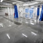 Solid epoxy coating installed in a interior space of a car washing space