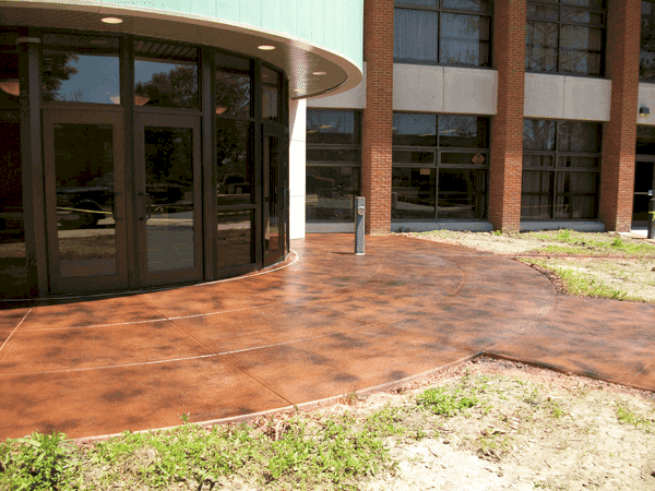 Stained concrete patio installed on a sidewalk of a commercial area in San Antonio