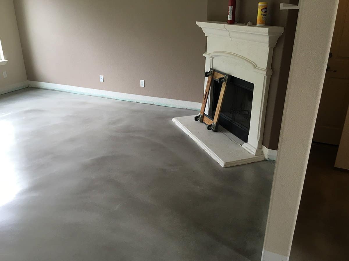 Newly installed concrete epoxy floor and concrete staining in a house