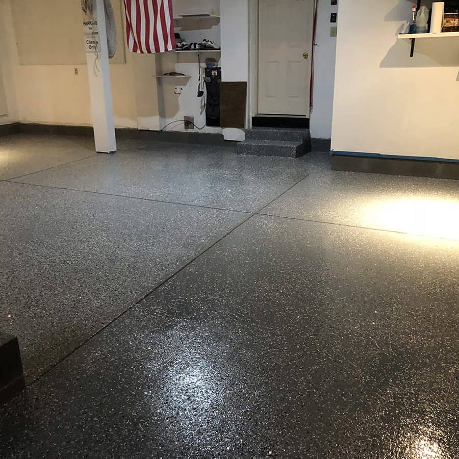 Black chip epoxy flooring design of a garage